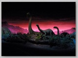 We travel through primeval dioramas, complete with prehistoric flora, fauna and audio-animatronic dinosaurs